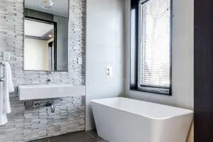 bathroom with one wall with beadboard