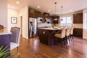 kitchen with yellow backsplash and hardwood floors