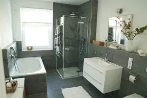 shower with glass enclosure, door open outward